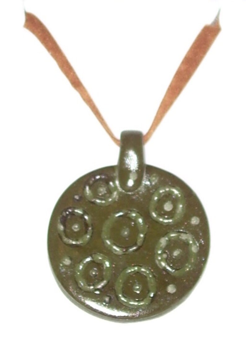 Ochre disc pendant for the Summer Celtic design velvet ribbon