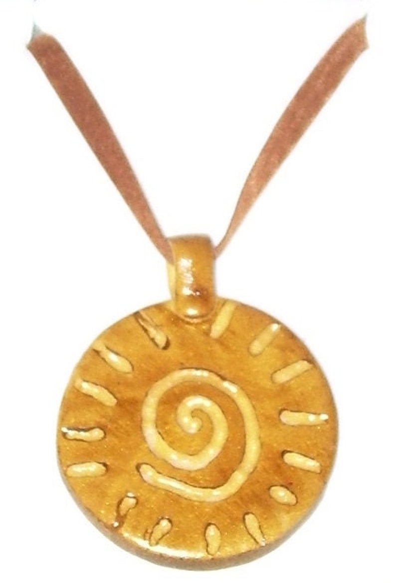 Ochre disc pendant for the Summer Celtic design velvet ribbon