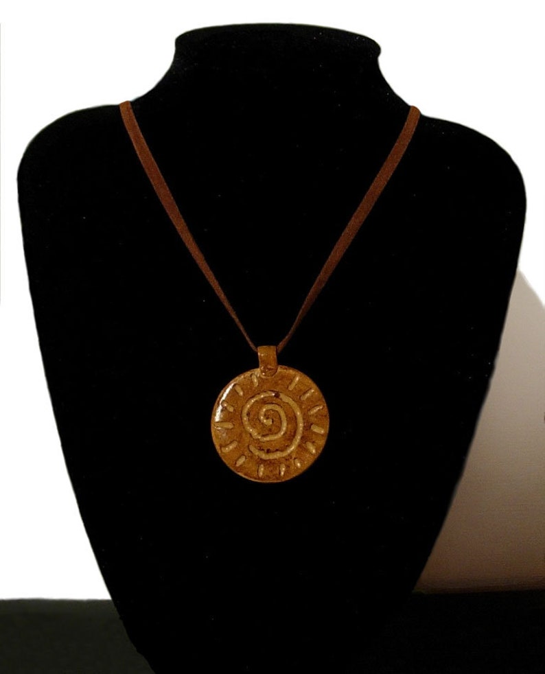 Ochre disc pendant for the Summer Celtic design velvet ribbon