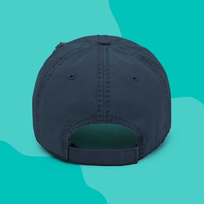Back side of a navy distressed dad hat that is embroidered with the words Mental Health Matters.
