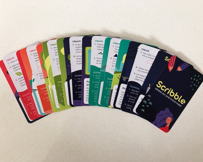 Illustrated card deck displaying drawing and journaling activities for mental health.