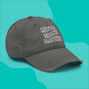 Side view of Mental Health Matters embroidered on a grey distressed dad hat