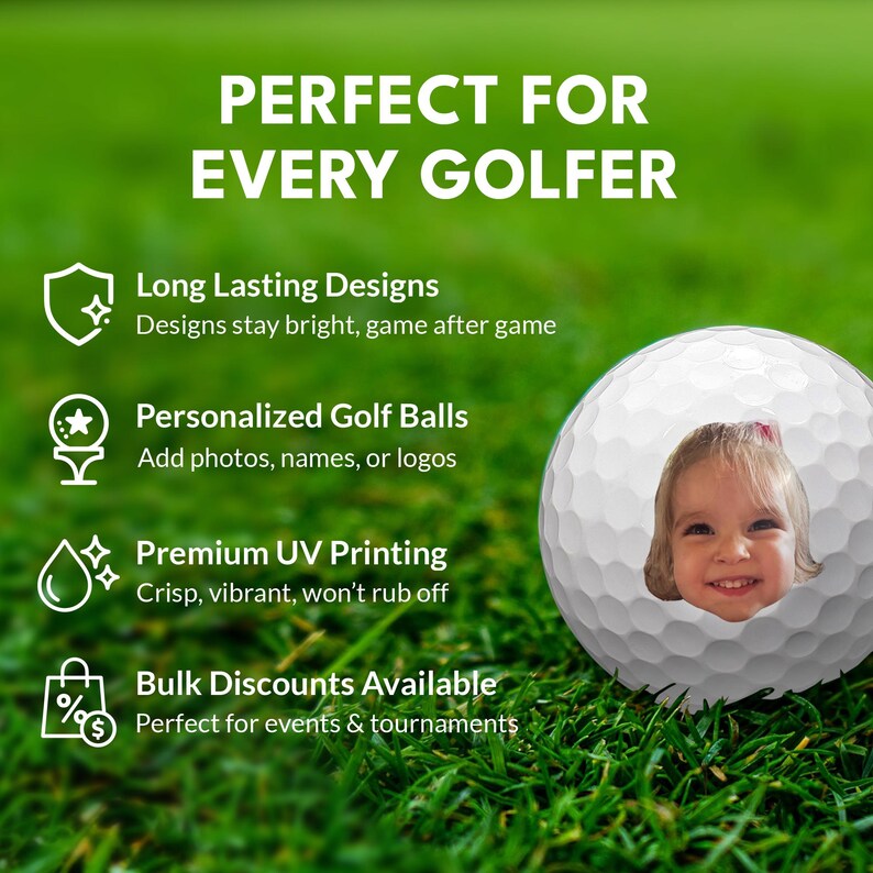 a golf ball with a young girl's face on it, set against a grassy background.