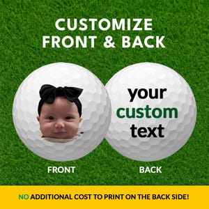 a baby wearing a black bow on a golf ball, with the text "CUSTOMIZE FRONT & BACK" and "your custom text" displayed on the golf ball.