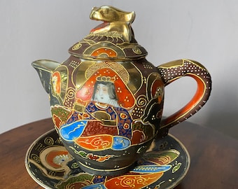 Vintage Noritake tea pot and matching plate. Beautiful vibrant colors and gold leaf.