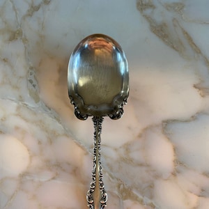 19th century sterling silver serving spoon. Stamped R Harris & Co Sterling 1873-1898.