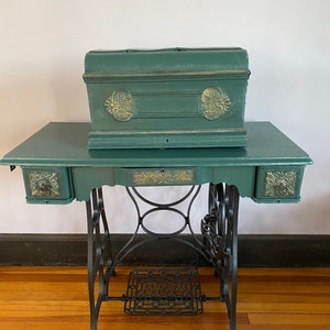 Vintage 1930’s Wannamaker Eccentric sewing machine with original table, drawers and hinged cover.