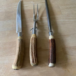 Vintage Boker USA carving set in stainless steel and faux bone. Good vintage condition.
