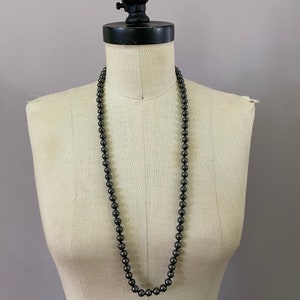 Vintage Hematite beaded necklace circa 1960 in perfect condition. 15” long.