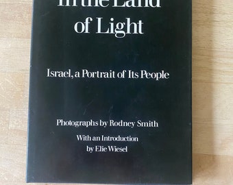In the Land of Light by Rodney Smith. Hardcover with jacket. 1983 edition. With an introduction by Elie Wiesel.