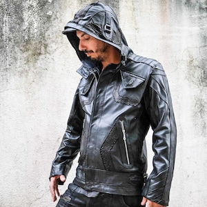 May include: A black leather jacket with a zippered hood and multiple pockets. The jacket has a textured design and a zippered closure.