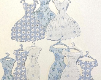 paper dress cut out Fashion Illustrator Completes His Cut-Out Dresses With Clouds And Buildings