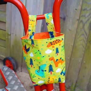 Lenkertasche Utensilo Grün Dinos Bett Gitterbett Spielzeugtasche Aufbewahrung Kinderbett Schnullertasche Laufrad Roller Deirad Osterkorb