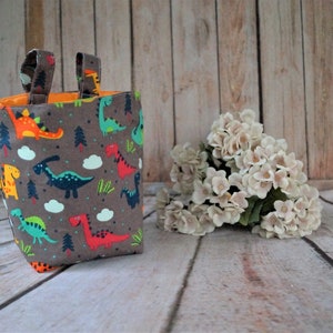 Lenkertasche Utensilo braun Dinos Bett Gitterbett Spielzeugtasche Aufbewahrung Kinderbett Schnullertasche Laufrad Roller Deirad Kinderwagen