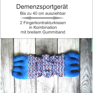 May include: A blue and patterned finger exercise device. The device has blue finger separators on each end and a patterned fabric center. The text at the top says "Demenzerportgerät" and "Bis zu 40 cm ausziehbar".