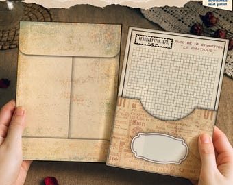 May include: Two vintage-style coin envelopes with pockets. The envelopes are beige with a distressed, aged appearance. One envelope is closed, while the other is open, revealing a grid-lined interior and decorative labels. Text includes "6 Coin Envelopes with Pockets."