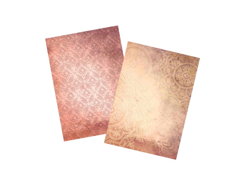 May include: Two decorative paper sheets with different patterns. One sheet has a pink and white damask pattern. The other sheet has a light brown background with a gold mandala pattern.