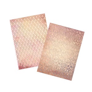 May include: Two sheets of decorative paper with a gold foil finish. The paper has a delicate floral pattern and a subtle pink and white ombre effect.