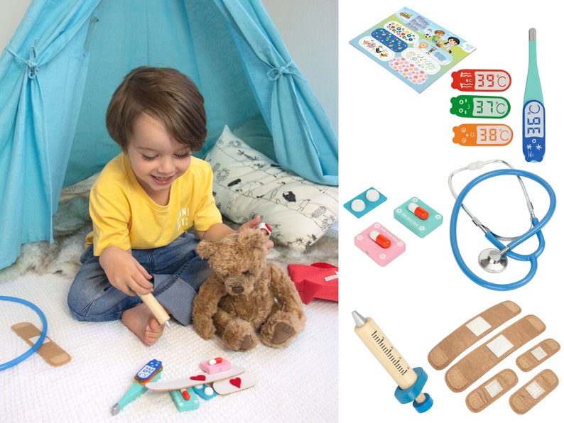 May include: A child plays doctor with a teddy bear using a toy stethoscope, thermometer, bandages, and pills. The play doctor set is made of wood and plastic.