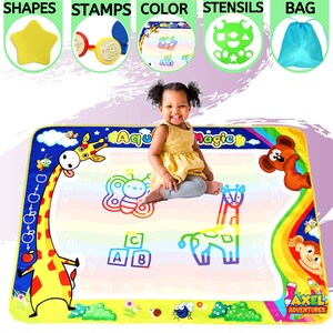 May include: A colorful water-activated drawing mat with a giraffe, butterfly, and other animal illustrations. The mat features letters, numbers, and shapes. A child is sitting on the mat, demonstrating how to use it.