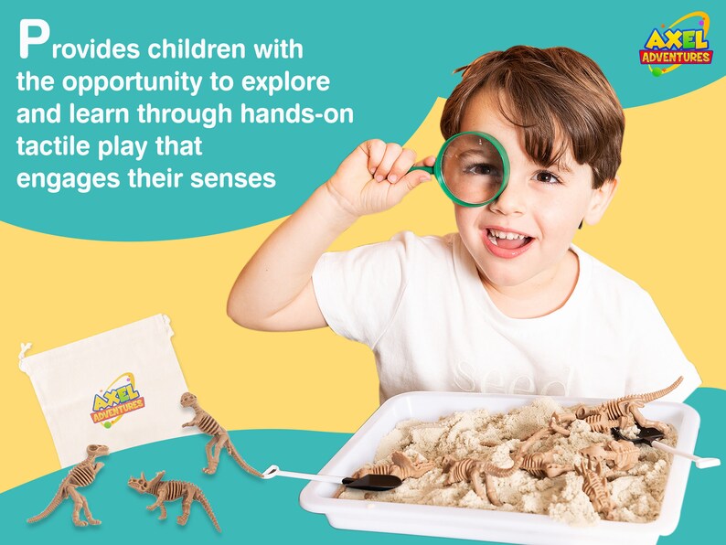 May include: A child smiles while holding a magnifying glass, with a dinosaur excavation kit in front of them. The kit includes a white tray with sand, toy dinosaur skeletons, a small shovel, and a canvas bag with the "AXEL ADVENTURES" logo.