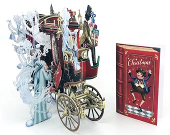 May include: A 3D pop-up greeting card featuring a detailed red and black carriage with ghostly figures and a top-hatted driver, accompanied by a separate red card cover titled How to Keep Christmas Well with an illustration of a dancing character.