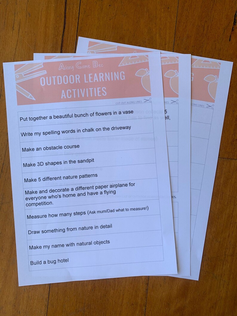 May include: Three white sheets of paper with the text "Along Came Bec OUTDOOR LEARNING ACTIVITIES" in peach and white. The sheets contain a list of outdoor activities, including making a bug hotel and drawing from nature.