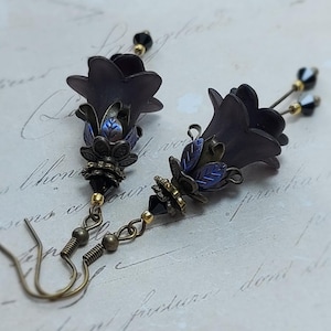 Gothic black double flower earrings, double bell flower have been combined with antique bronze floral bead caps for an art nouveau feel, jet black crystal drops hang from under the flowers to add sparkle. Gothic fairy jewellery, Earring gift for her.