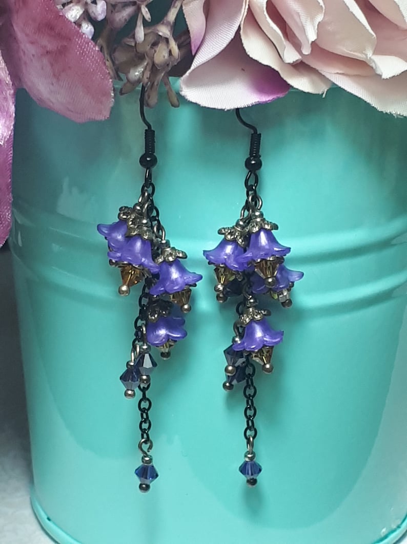 Handmade long chain dangle earrings with multi small purple flowers with yellow crystal centres and deep purple crystal droplets. Black chain and earring hooks. Bohemian Witchy Jewellery, Gift for goth, Gothic Floral Dangles,