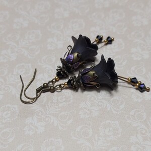 Gothic black double flower earrings, double bell flower have been combined with antique bronze floral bead caps for an art nouveau feel, jet black crystal drops hang from under the flowers to add sparkle. Gothic fairy jewellery, Earring gift for her.
