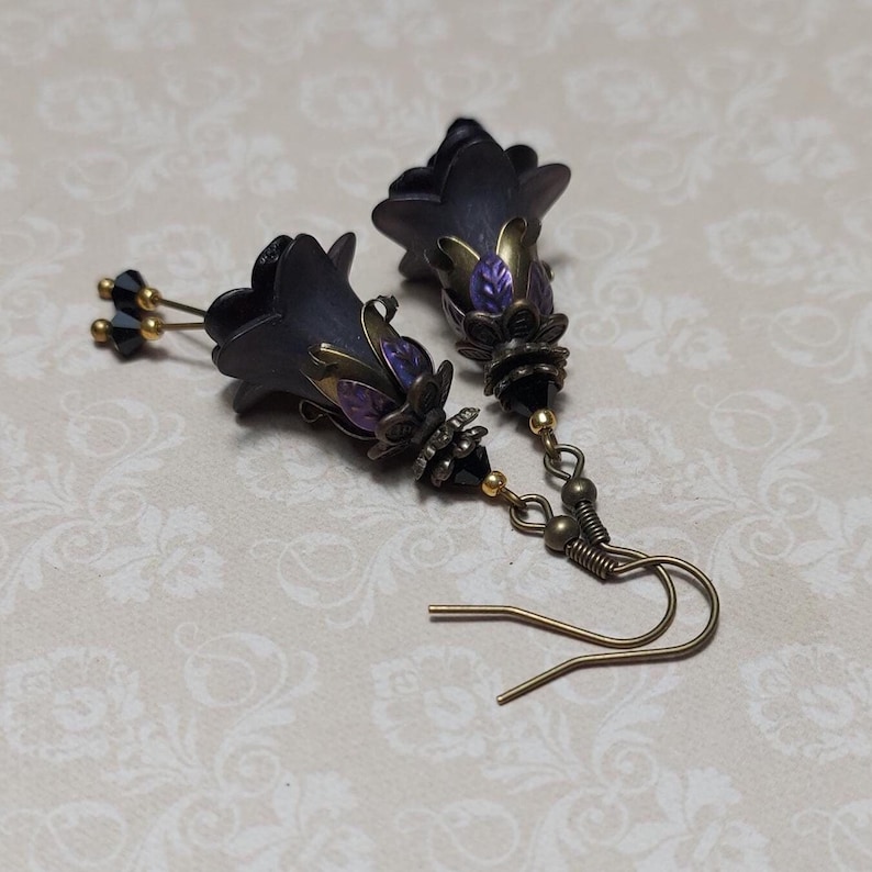 Gothic black double flower earrings, double bell flower have been combined with antique bronze floral bead caps for an art nouveau feel, jet black crystal drops hang from under the flowers to add sparkle. Gothic fairy jewellery, Earring gift for her.