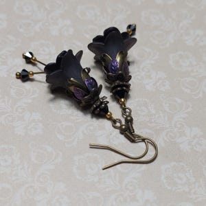 Gothic black double flower earrings, double bell flower have been combined with antique bronze floral bead caps for an art nouveau feel, jet black crystal drops hang from under the flowers to add sparkle. Gothic fairy jewellery, Earring gift for her.
