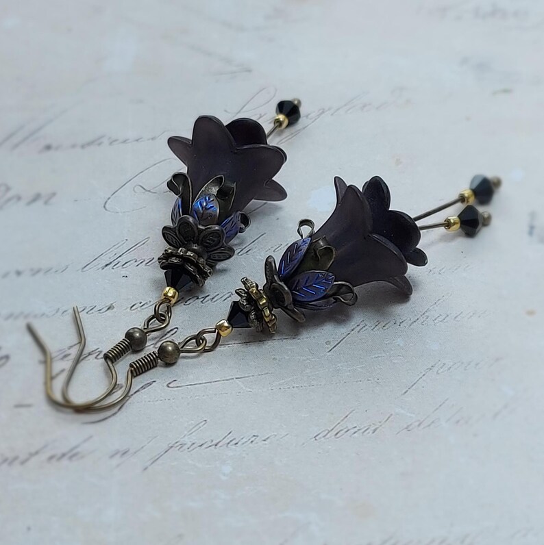 Gothic black double flower earrings, double bell flower have been combined with antique bronze floral bead caps for an art nouveau feel, jet black crystal drops hang from under the flowers to add sparkle. Gothic fairy jewellery, Earring gift for her.
