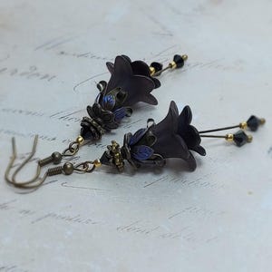Gothic black double flower earrings, double bell flower have been combined with antique bronze floral bead caps for an art nouveau feel, jet black crystal drops hang from under the flowers to add sparkle. Gothic fairy jewellery, Earring gift for her.