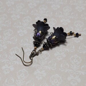 Gothic black double flower earrings, double bell flower have been combined with antique bronze floral bead caps for an art nouveau feel, jet black crystal drops hang from under the flowers to add sparkle. Gothic fairy jewellery, Earring gift for her.