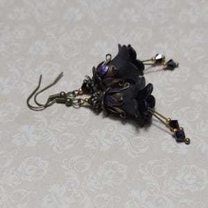 Gothic black double flower earrings, double bell flower have been combined with antique bronze floral bead caps for an art nouveau feel, jet black crystal drops hang from under the flowers to add sparkle. Gothic fairy jewellery, Earring gift for her.
