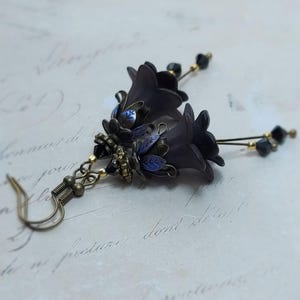 Gothic black double flower earrings, double bell flower have been combined with antique bronze floral bead caps for an art nouveau feel, jet black crystal drops hang from under the flowers to add sparkle. Gothic fairy jewellery, Earring gift for her.