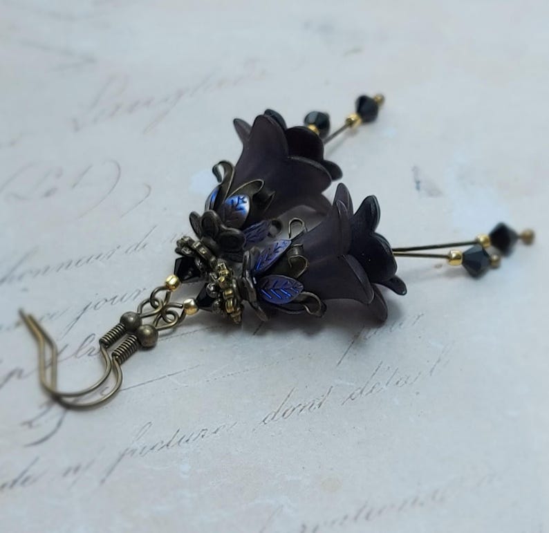 Gothic black double flower earrings, double bell flower have been combined with antique bronze floral bead caps for an art nouveau feel, jet black crystal drops hang from under the flowers to add sparkle. Gothic fairy jewellery, Earring gift for her.