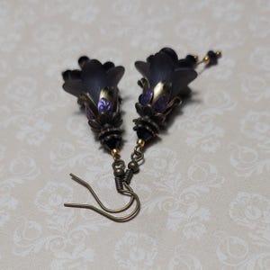 Gothic black double flower earrings, double bell flower have been combined with antique bronze floral bead caps for an art nouveau feel, jet black crystal drops hang from under the flowers to add sparkle. Gothic fairy jewellery, Earring gift for her.