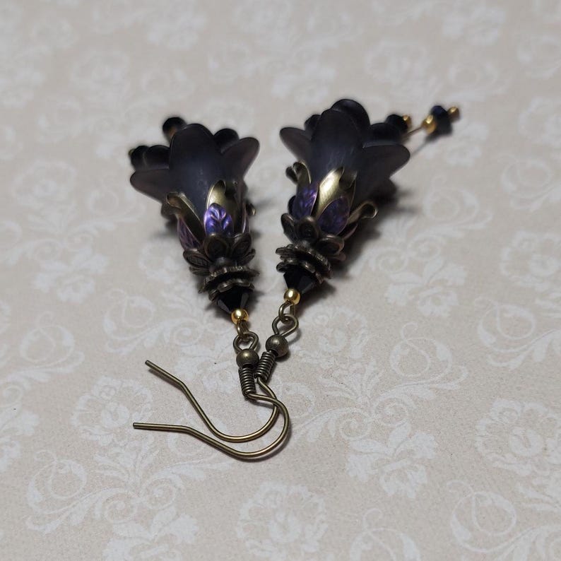 Gothic black double flower earrings, double bell flower have been combined with antique bronze floral bead caps for an art nouveau feel, jet black crystal drops hang from under the flowers to add sparkle. Gothic fairy jewellery, Earring gift for her.