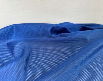 May include: A close-up of a blue mesh fabric with a small, repeating pattern of holes. The fabric is soft and flexible, and it has a slightly textured surface.