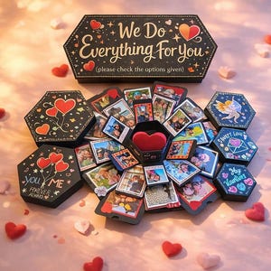 May include: A black, multi-layered gift box with photos, hearts, and text. The box is open, revealing photos and a heart-shaped compartment. The top of the box reads "We Do Everything For You". Decorative hearts are scattered around.