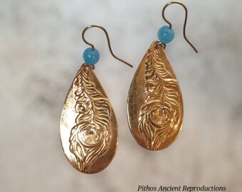 Antique style drop earrings with feather craftsmanship and turquoise stone. Nickel free.