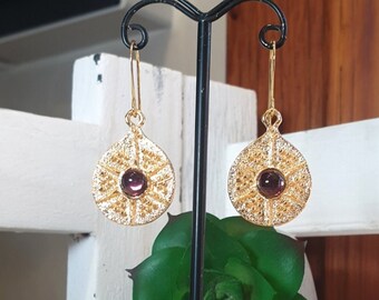 Antique drop style earrings with central Amethyst stone. Craftsmanship.
