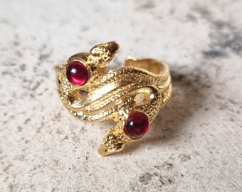 Antique style ring depicting two snakes with glass paste stone and craftsmanship. No nickel. Adjustable size.