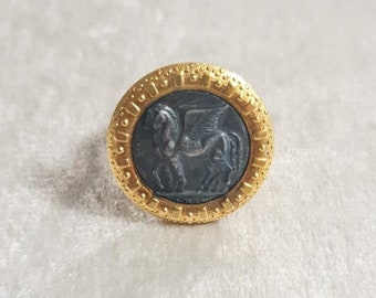 Reproduction ring in gold-plated brass. Central with winged horses of Tarquinia