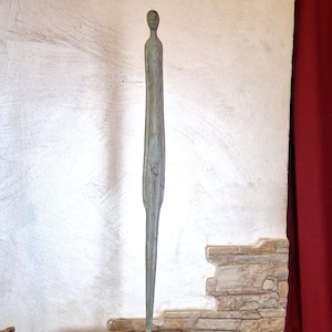 Reproduction of the evening shadow statue, Etruscan man in bronze.