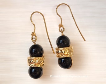 Antique style earrings with two onyx stones and brass insert with 24k gold bath. Nickel free.