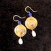 Emma reviewed Brass earrings with gold bath. Decorated with the owl of Athena and pearl in lapis lazuli