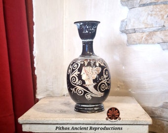 Reproduction of the Apulian Lekythos vase in the Gnathia style. Made with the same techniques used in ancient times. Height 16.5 cm.
